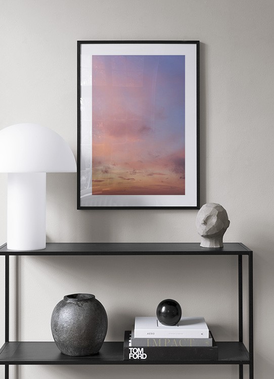  – Fotografie eines Sonnenuntergangs mit rosa Wolken vor einem Himmel in hellem Violett