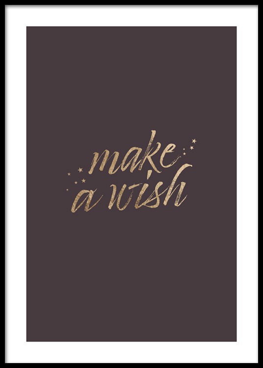  – Texte « Make a wish » écrit en doré sur un fond marron