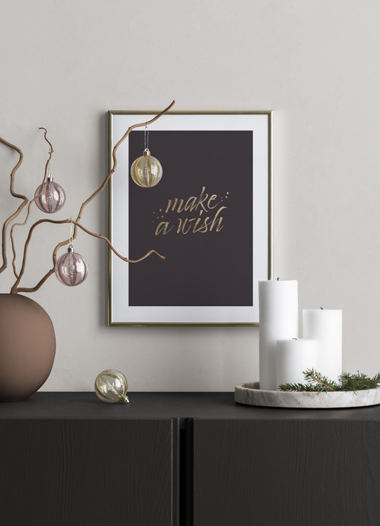  – Text „Make a wish“ in Gold auf einem braunen Hintergrund